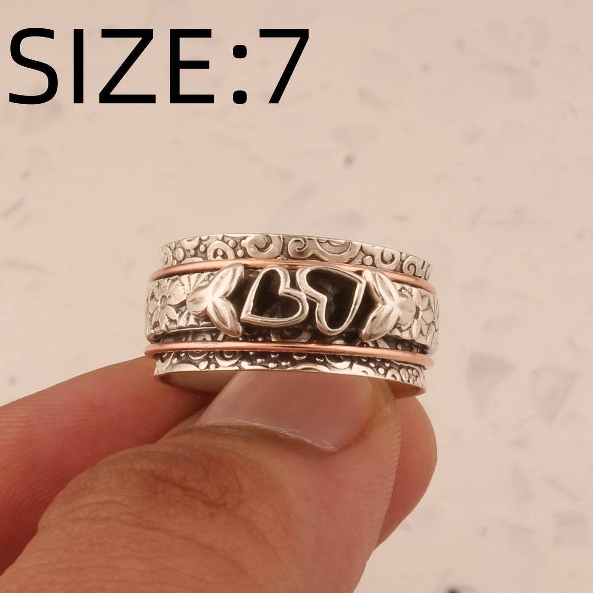 Vintage verzilverde spinner ring met vlinder en hart