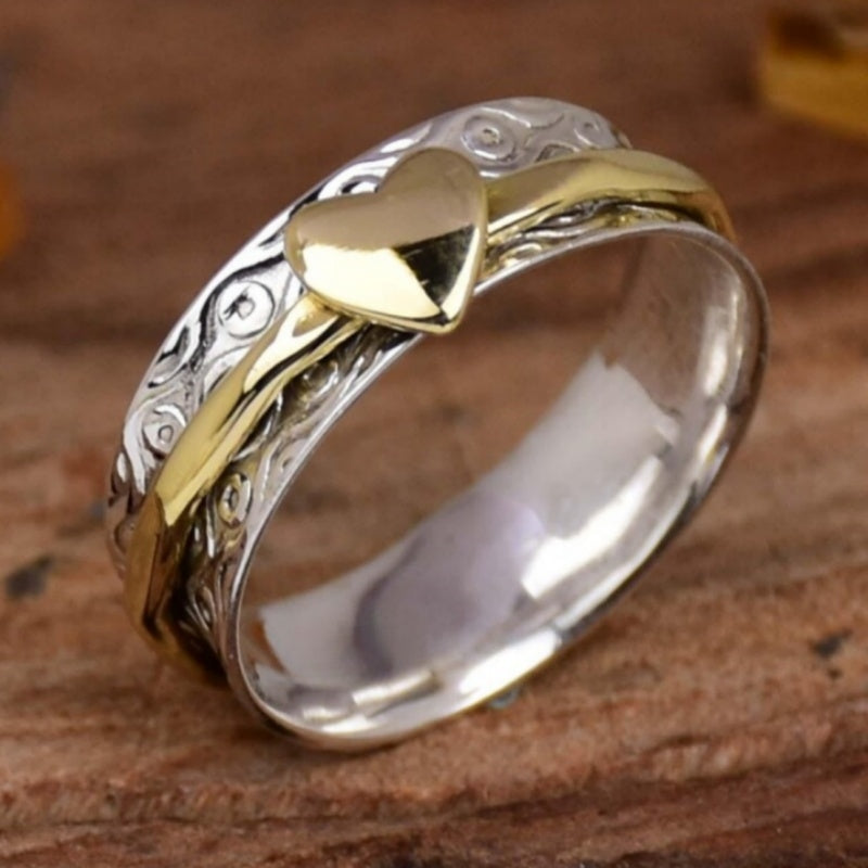 Vintage tweekleurige spinner ring met hartpatroon