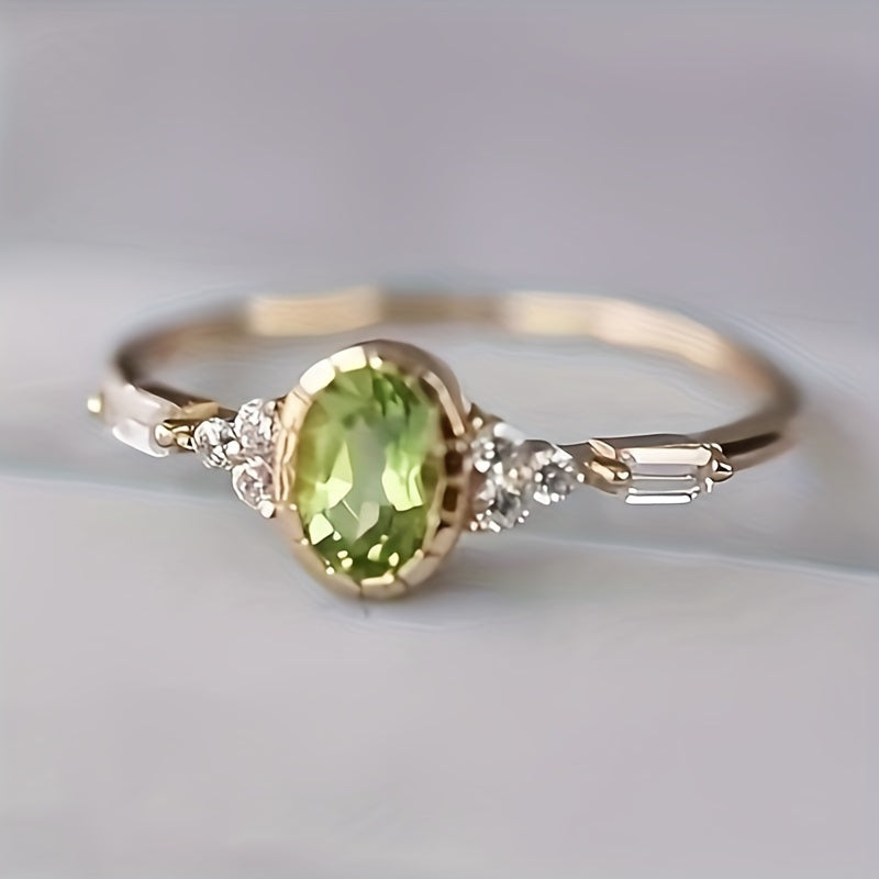 Vintage vergulde ring met ovale groene zirkonia en diamantaccent