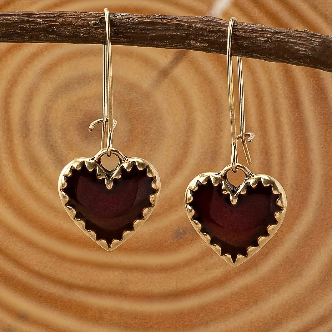 Vintage bohemien oorbellen met rood druipend hart van hars