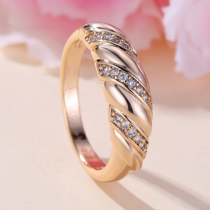Elegant Zirconia Inlaid Twisted Design Gold Plated Ring