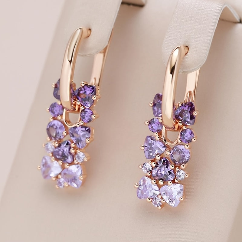 Elegante vergulde oorringen met paarse zirkonia