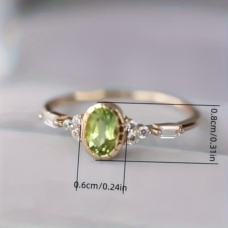 Vintage vergulde ring met ovale groene zirkonia en diamantaccent