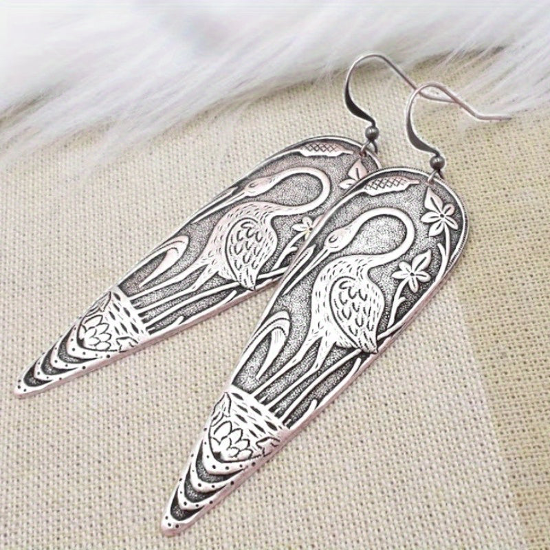 Elegante oorhangers met reigermotief