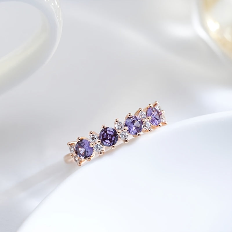 Elegante ring met paarse zirkonia en diamantaccent