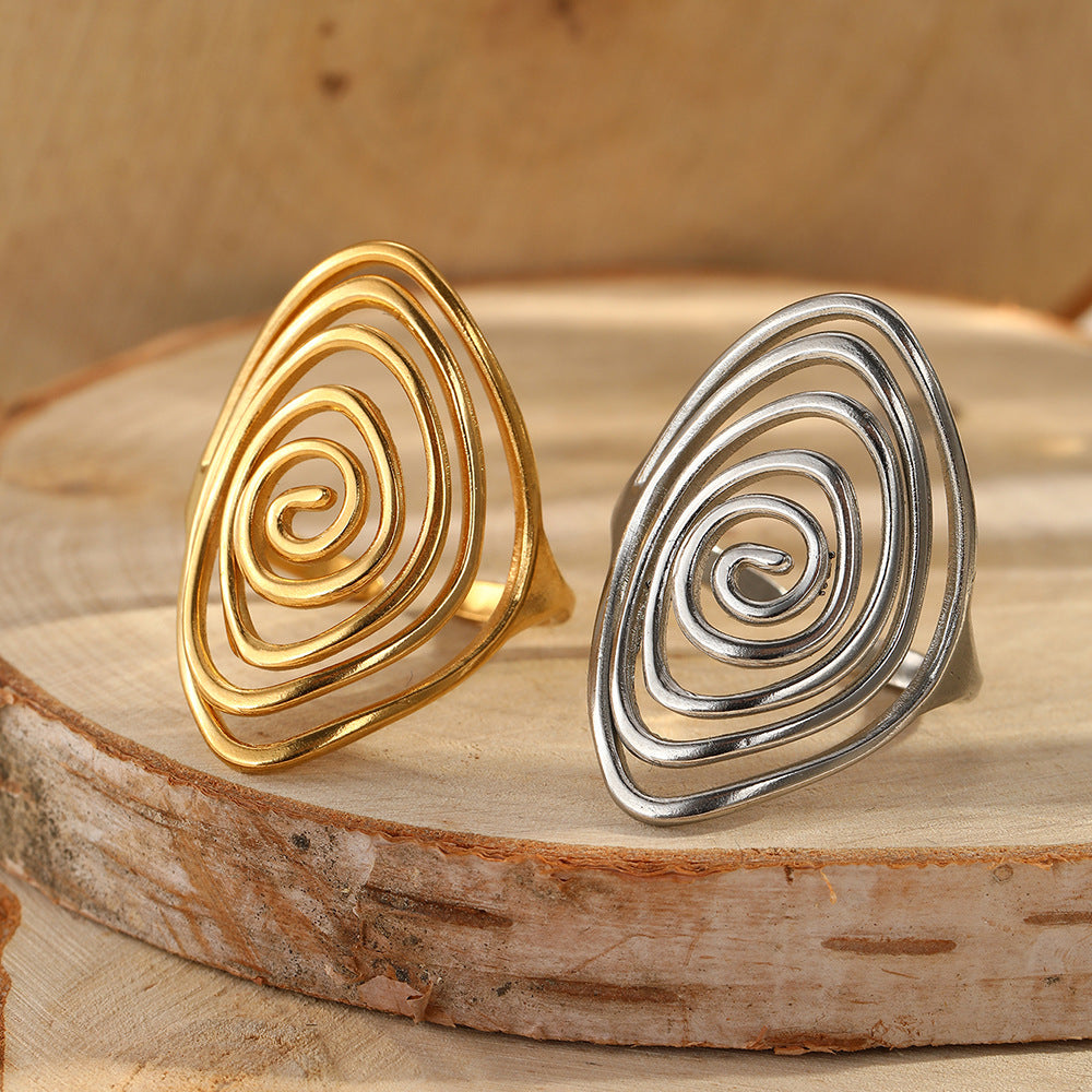 Vortex sculpturale goudkleurige spiraal statement ring