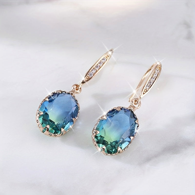 Elegante vintage geïnspireerde oorhangers met ovaal groen kristal