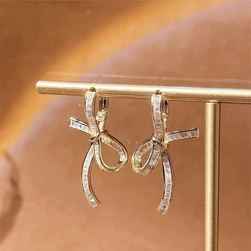 Elegante oorhangers met baguette diamanten lint
