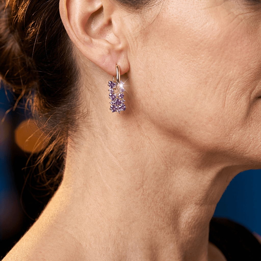 Elegante vergulde oorringen met paarse zirkonia