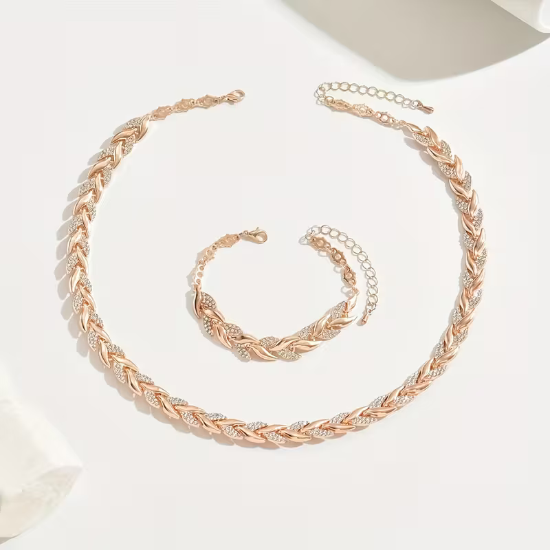 Rosé goud- en zilverkleurige bladschakel ketting- en armbandset
