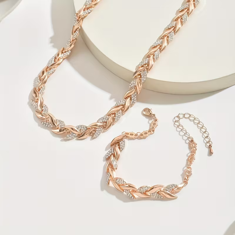 Rosé goud- en zilverkleurige bladschakel ketting- en armbandset