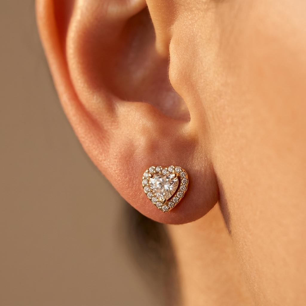 Elegante goudkleurige sieradenset met harthanger ketting en oorbellen