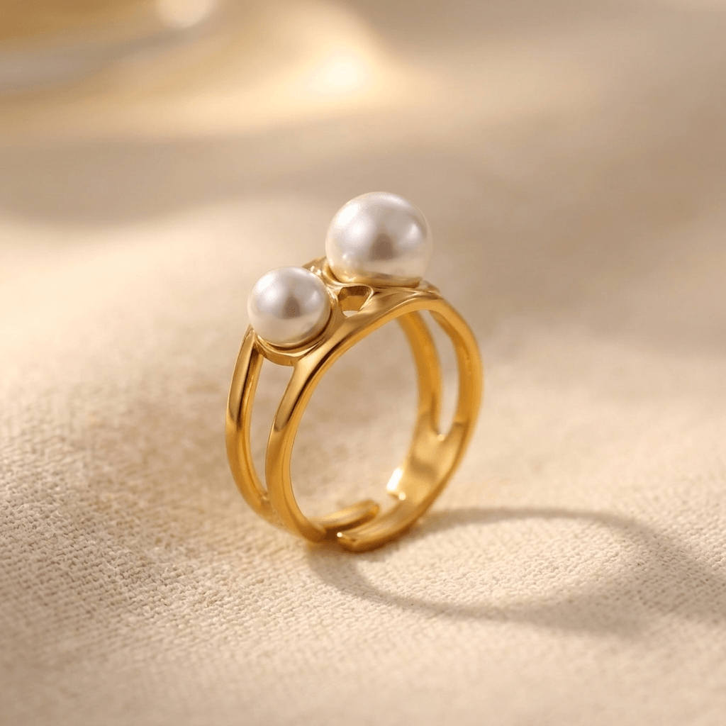 Goudkleurige geometrische open ring met dubbele parel