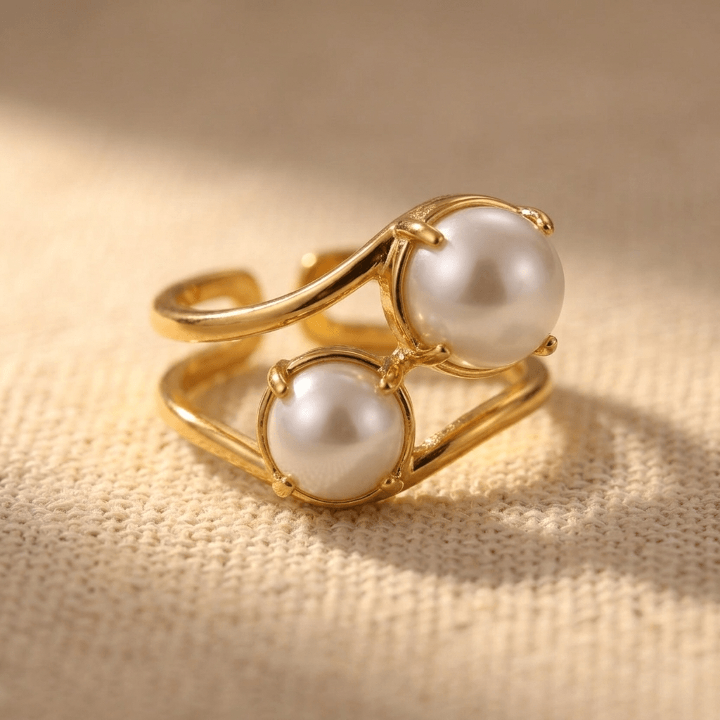 Goudkleurige geometrische open ring met dubbele parel