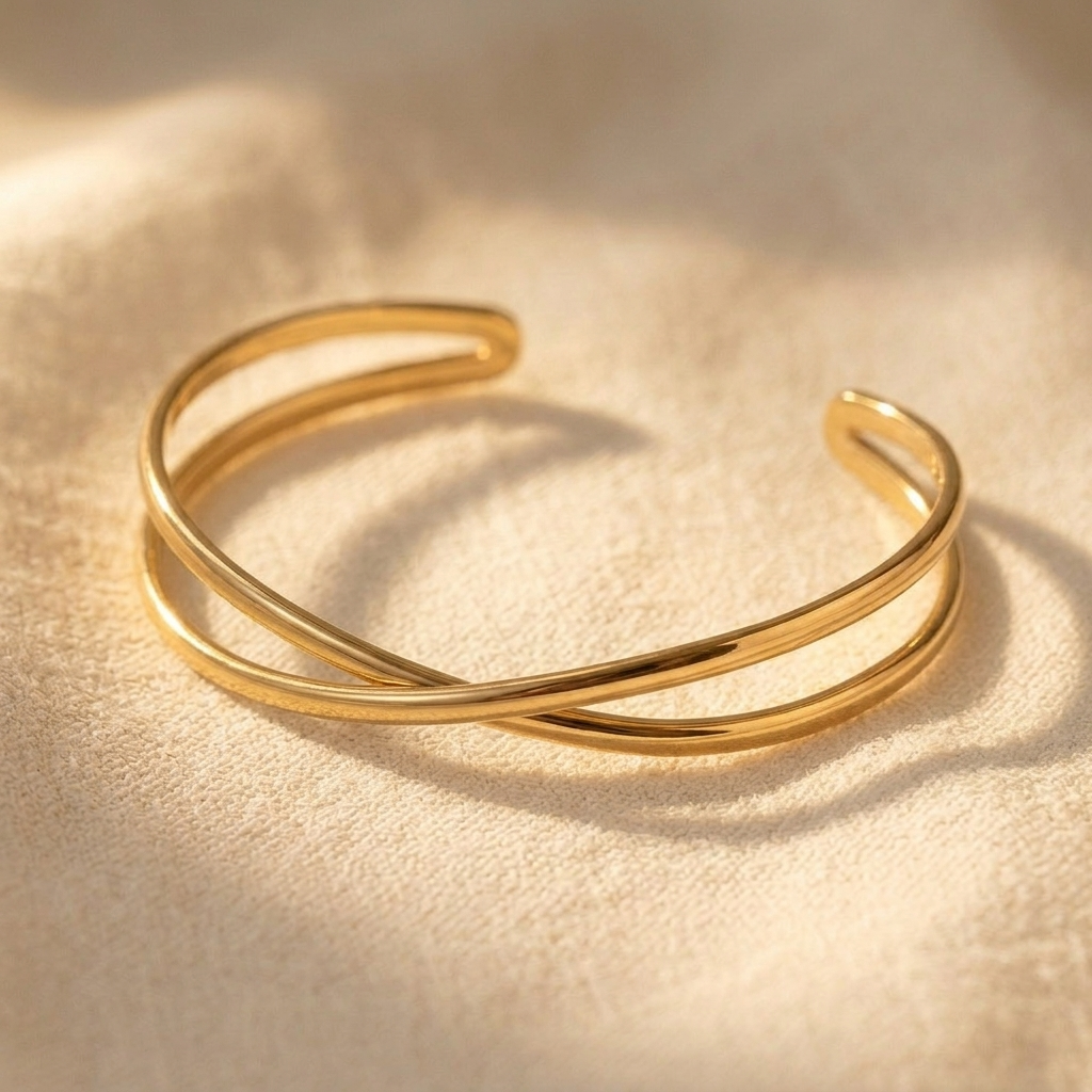 Goudkleurige gedraaide open cuff armband