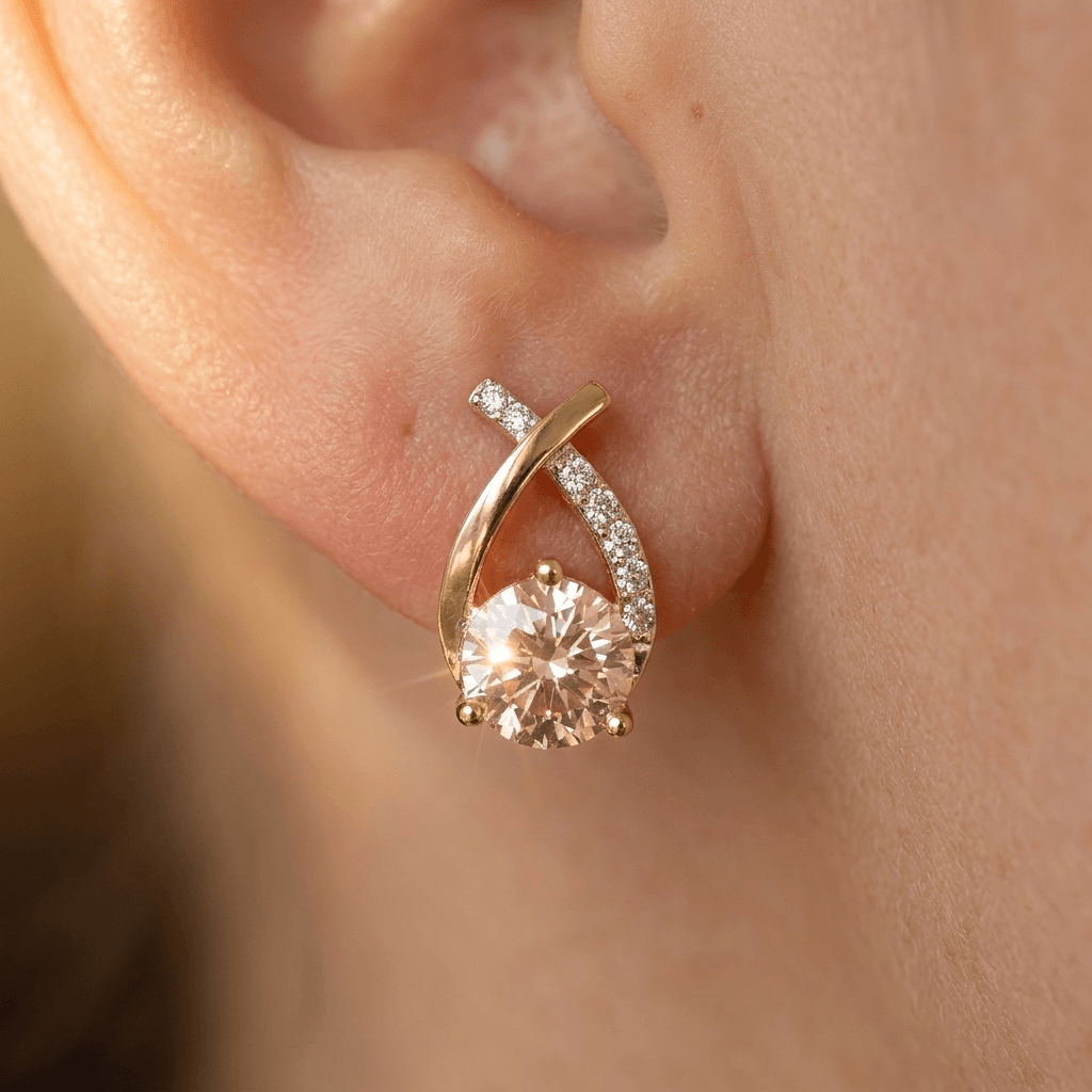 Goudkleurige druppel oorknopjes met champagne zirkonia